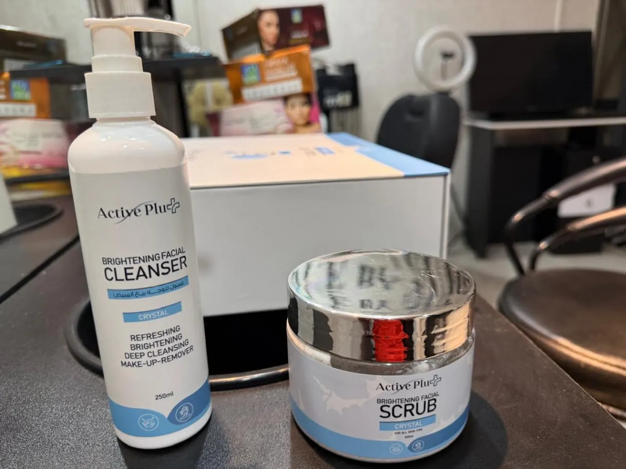 Active Plus brightening facial cleanser and facial scrub containers
