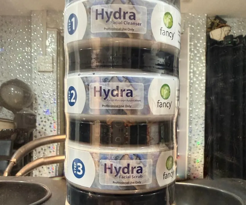 Three Hydra facial skincare product jars