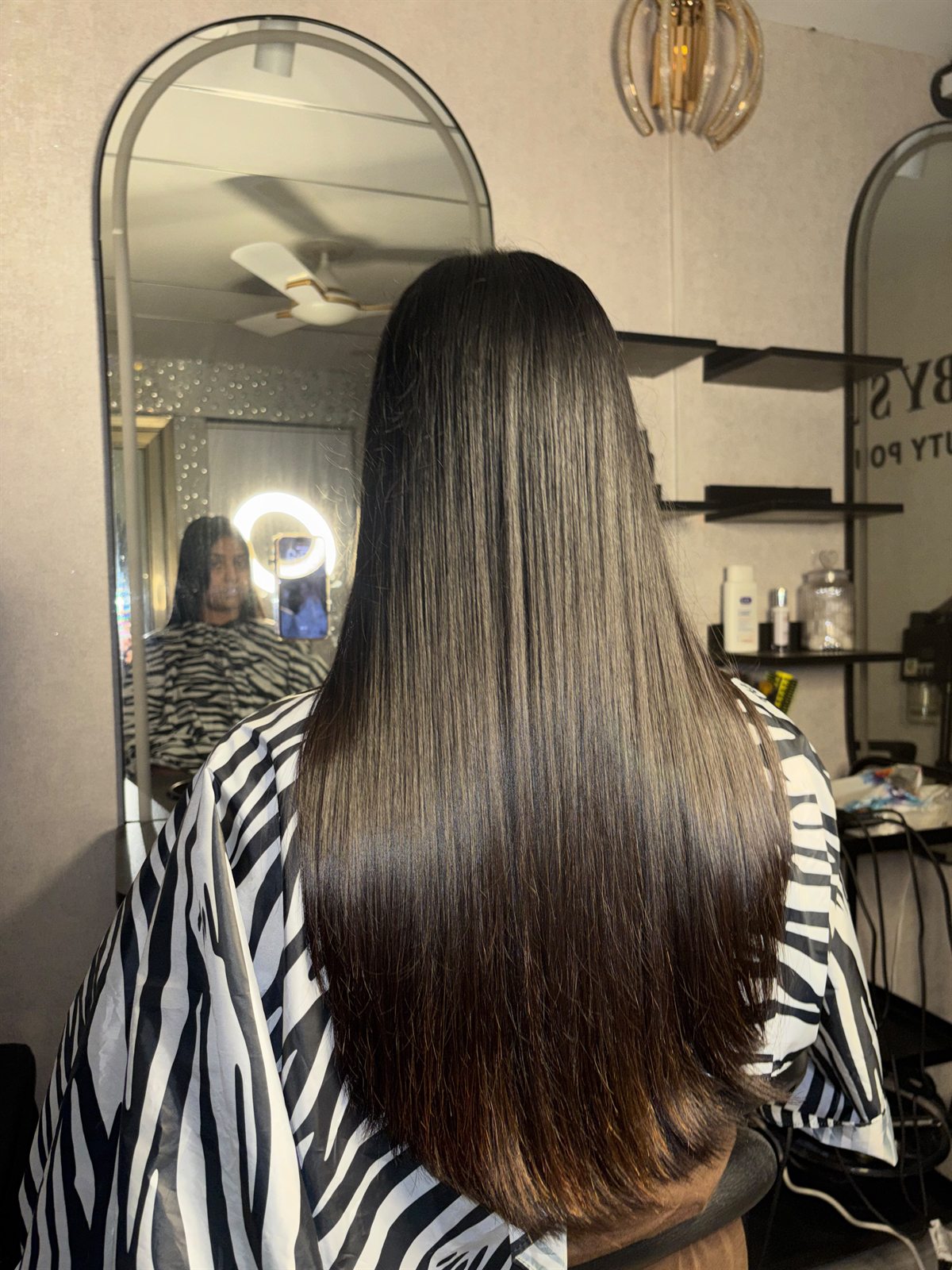 Hair repair treatment result showing smooth straight hair texture